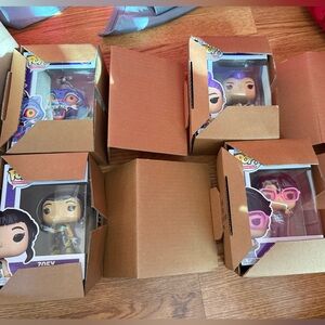 Funko Pop Vinyl Figures with Purple and Brown Accents